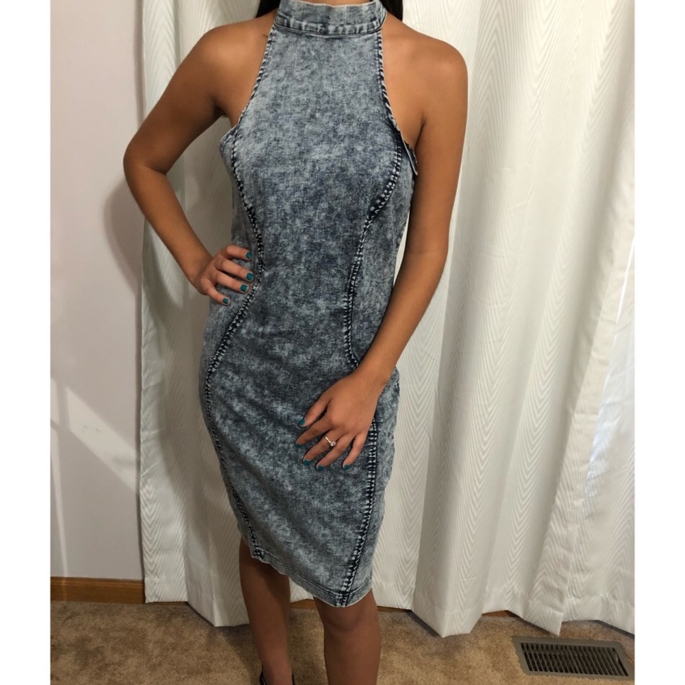 Rendered in denim fitted sleeveless dress